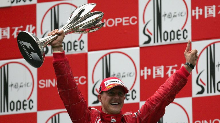 SHANGHAI, CHINA - OCTOBER 01:  Michael Schumacher of Germany and Ferrari celebrates on the podium after winning the Formula One Chinese Grand Prix at Shang