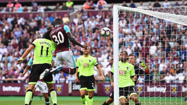 LONDON, ENGLAND - AUGUST 21: Michail Antonio of West Ham United heads the opening goal during the Premier League match between West Ham United and AFC Bour