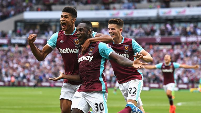 LONDON, ENGLAND - AUGUST 21: Michail Antonio (#30) of West Ham United celebrates scoring the opening goal with team mates during the Premier League match b