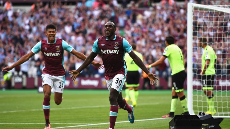 LONDON, ENGLAND - AUGUST 21:  Michail Antonio (#30) of West Ham United celebrates scoring the opening goal with team mate Ashley Fletcher during the Premie