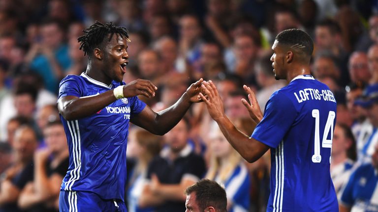 Michy Batshuayi of Chelsea (L) celebrates scoring his side's third goal against Bristol Rovers
