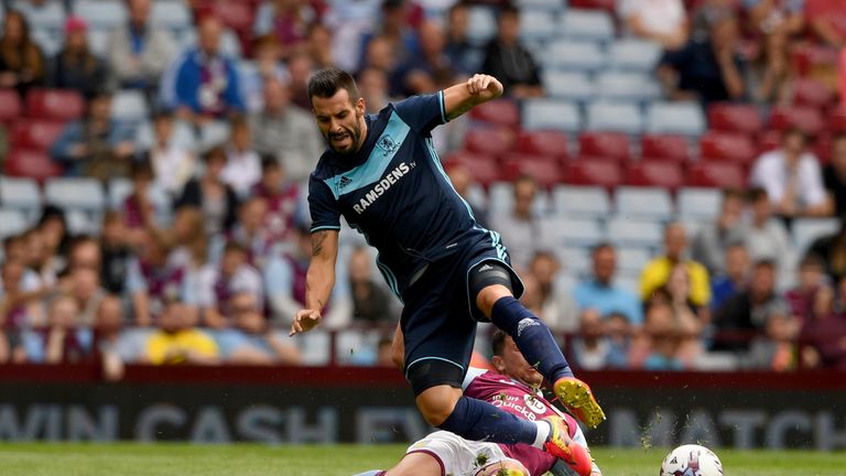 Middesbrough forward Alvaro Negredo is fouled by Tommy Elphick of Aston Villa 