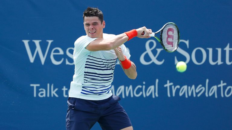 MASON, OH - AUGUST 19: Milos Raonic of Canada hits a return shot to Dominic Thiem of Austria during a quarterfinal match on Day 7 of the Western & Southern