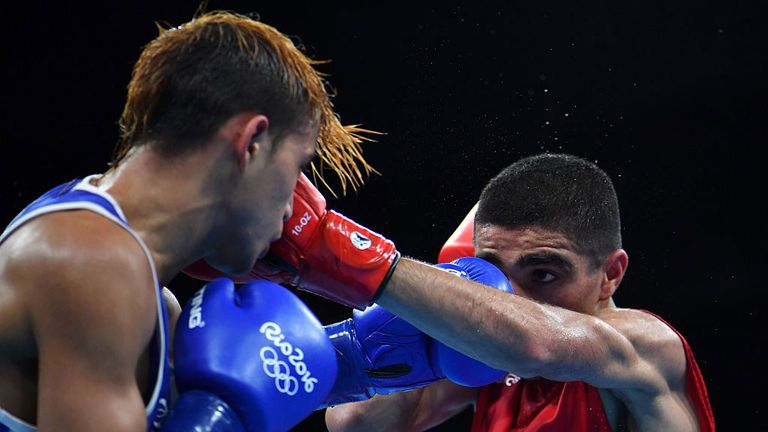 Great Britain's Muhammad Ali (R) fights Venezuela's Yoel Segundo Finol 
