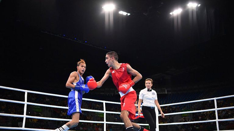 Great Britain's Muhammad Ali (R) fights Venezuela's Yoel Segundo Finol during the Men's Fly (52kg) match at the Rio 2016 Olympic Games