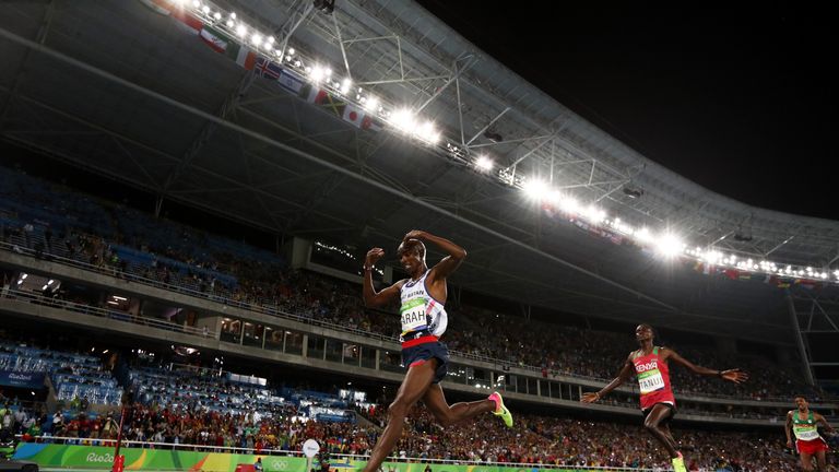 Mo Farah of Great Britain celebrates winning the Men's 10,000m ahead of Paul Kipngetich Tanui of Kenya at the Olympics in Rio