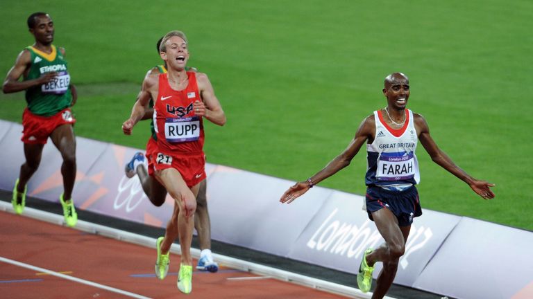 LONDON, ENGLAND - AUGUST 04:  Mohamed Farah of Great Britain crosses the line to win gold in the Men's 10,000m Final on Day 8 of the London 2012 Olympic Ga