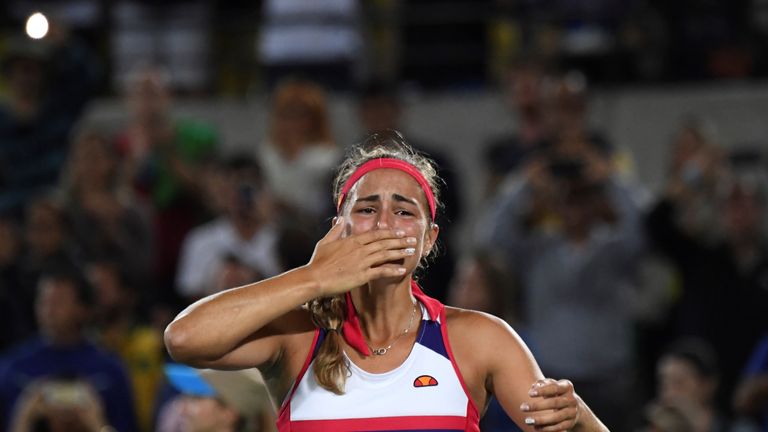 Puerto Rico's Monica Puig reacts after winning her women's singles final tennis match against Germany's Angelique Kerber at the Olympic Tennis Centre of th