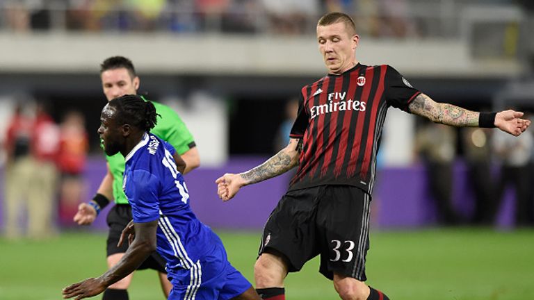MINNEAPOLIS, MN - AUGUST 3: Kucka Juraj #33 of AC Milan trips Victor Moses #15 of Chelsea during the first half of the International Champions Cup match on