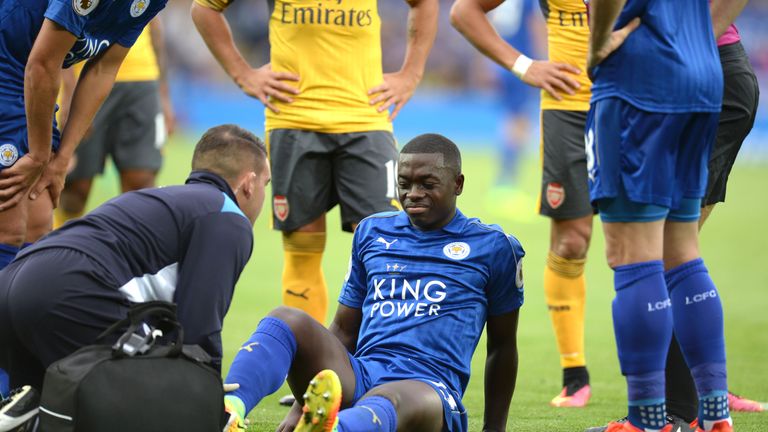 Nampalys Mendy (C) receives attention on the pitch