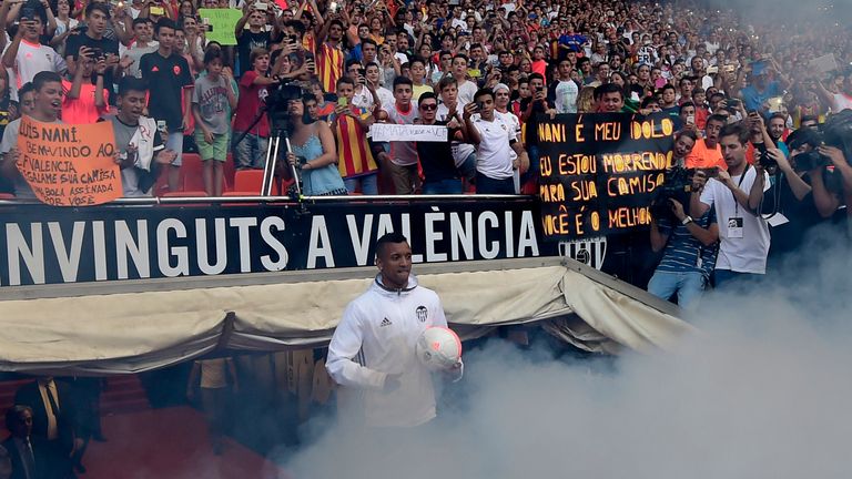 Valencia's new player Portuguese Luis Carlos Almeida de Cunha ' Nani ' holds a ball during his Official presentation in Valencia on July 14,2016