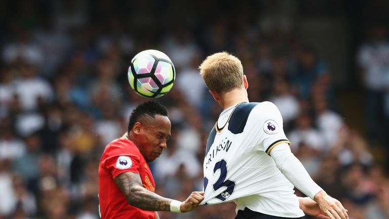 LONDON, ENGLAND - AUGUST 27: (L) Nathaniel Clyne of Liverpool and (R) Christian Eriksen of Tottenham Hotspur compete for the ball in the air during the Pre