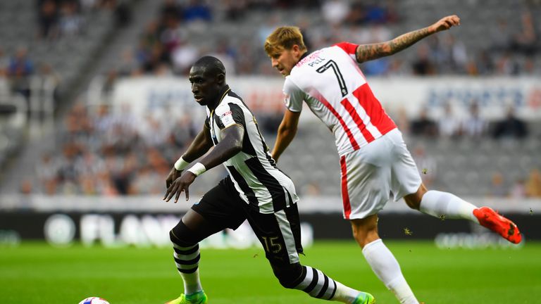 Mohamed Diame of Newcastle United goes past Harry Pell of Cheltenham Town during the EFL Cup second round match 