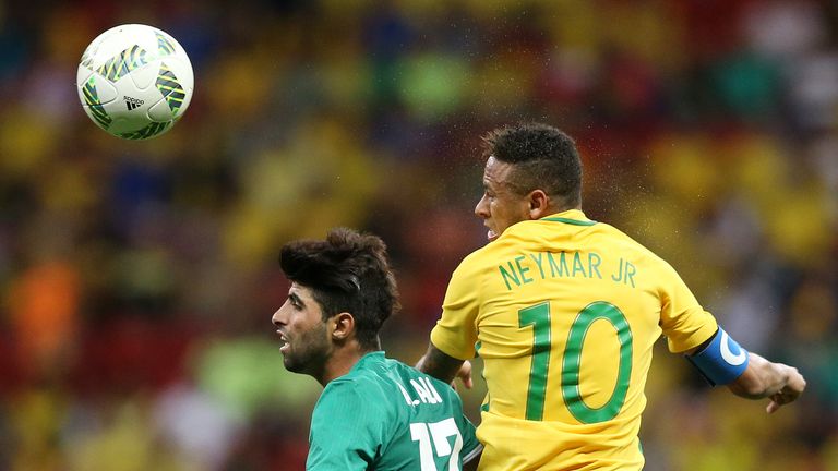 BRASILIA, BRAZIL - AUGUST 07: Neymar Jr #10 of Brazil and Alaa Ali #17 of Iraq during the men's soccer match between Brazil and Iraq at Mane Garrincha Stad