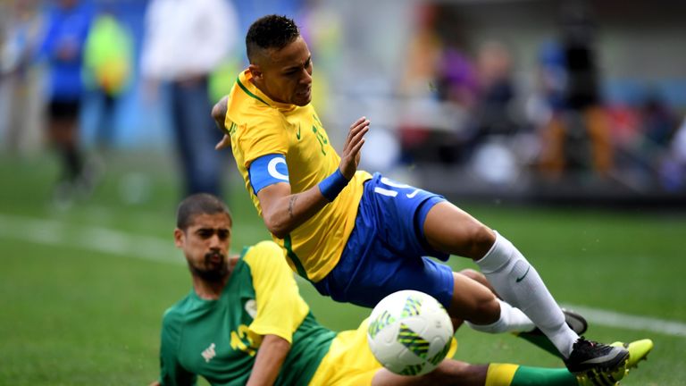 Brazil player Neymar vies for the ball with South Africa player Lebo Mothiba during the Rio 2016 Olympic Games First Round Group A men's football match Bra