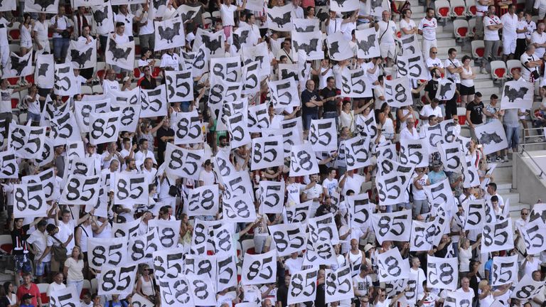 Nice fans held up white placards in tribute to the victims of the Bastille day attack in Nice