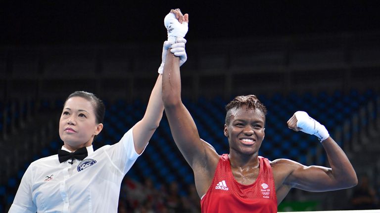 Nicola Adams celebrates after reaching the semi-finals