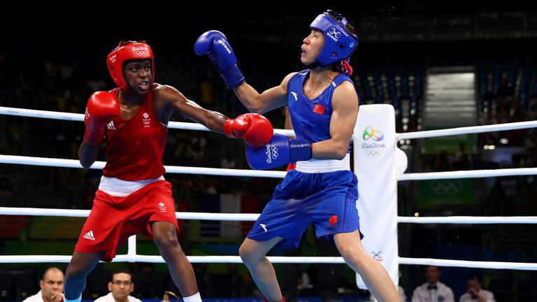 Nicola Adams (L) of Great Britain fights against Cancan Ren of China during a Women's Fly (48-51kg) Semifinal bout 