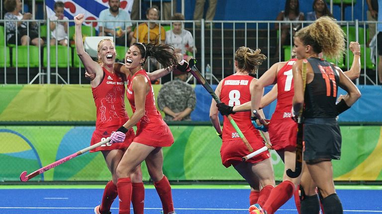 Britain's Nicola White (L) celebrates with teammate Britain's Sam Quek after scoring a goal during the women's Gold medal hockey Netherlands vs Britain mat