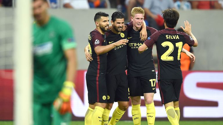 Nolito (2L) celebrates with teammates after scoring Manchester City's third