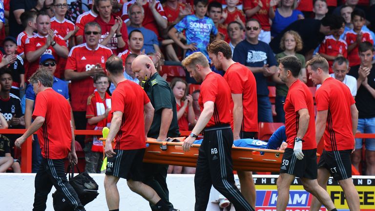Nottingham Forest goalkeeper Dorus de Vries is carried off against Burton Albion