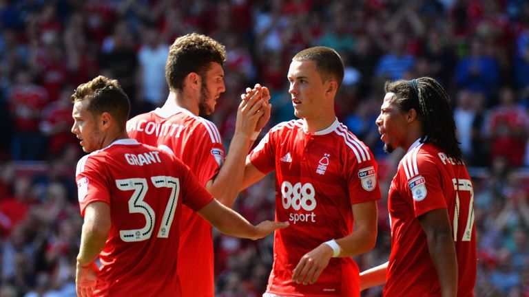 Thomas Lam of Nottingham Forest celebrates with team mates after scoring his side's second goal against Burton