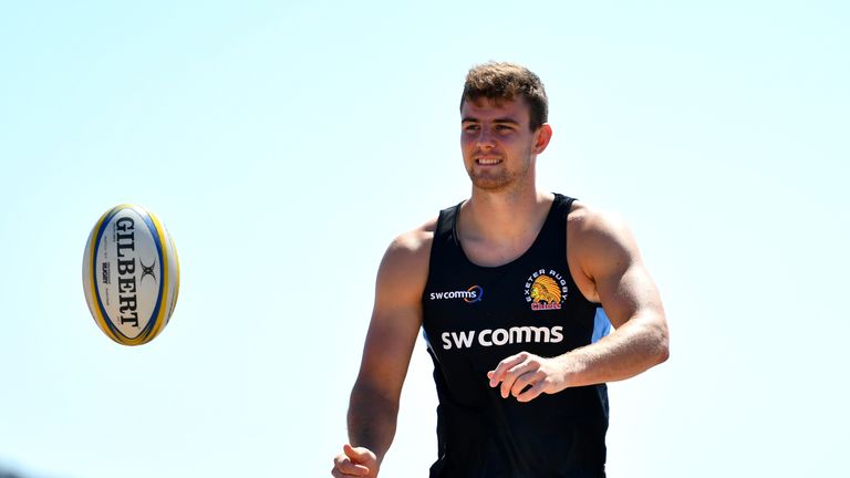 EXMOUTH, ENGLAND - JULY 19:  Ollie Devoto of Exeter Chiefs passes the ball during a training session on Exmouth Beach on July 19, 2016 in Exmouth, England.