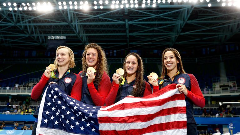 Allison Schmitt, Leah Smith, Maya Dirado and Katie Ledecky of the United States won gold in the 4x200m freestyle relay