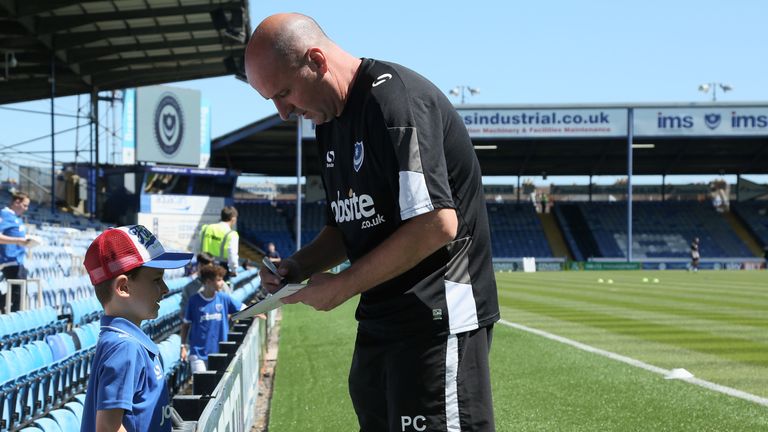 PORTSMOUTH, ENGLAND - AUGUST 6: Paul Cook signs autographs ahead of the Sky Bet League Two match between Portsmouth and Carlisle United at Fratton Park on 