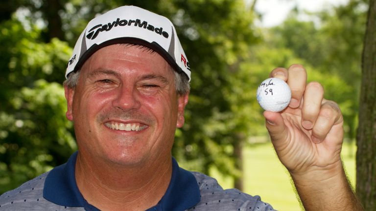 Paul Goydos shows off his 59 ball after the first round of the 2010 John Deere Classic