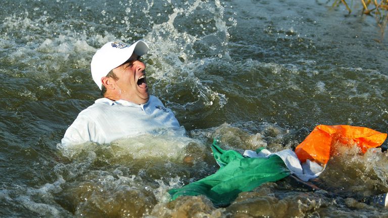 THE BELFRY - 29 SEPTEMBER:  Paul McGinley of Europe is thrown into the lake after holing the winning putt during the final day singles of the 34th Ryder Cu