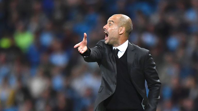 Pep Guardiola gestures from the touchline