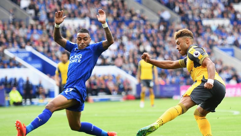 Alex Oxlade-Chamberlain of Arsenal takes on Danny Simpson of Leicester City during the Premier League match between Leicester and Arsenal