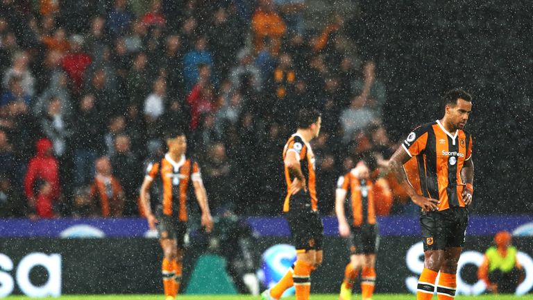 Tom Huddlestone and his Hull City team-mates appear dejected after Marcus Rashford scored during injury time