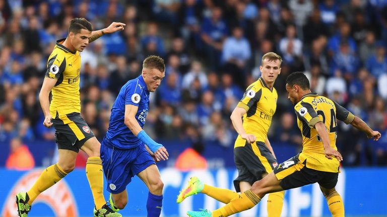 Francis Coquelin attempts to control the ball while under pressure from Jamie Vardy