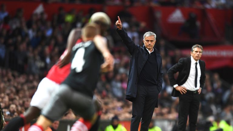 Jose Mourinho (C) signals from the touchline