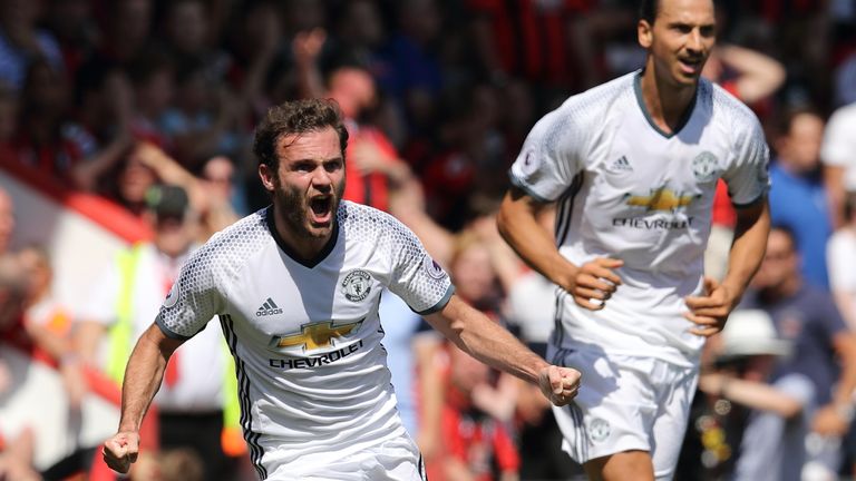 Juan Mata celebrates after scoring the opening goal for Manchester Untied