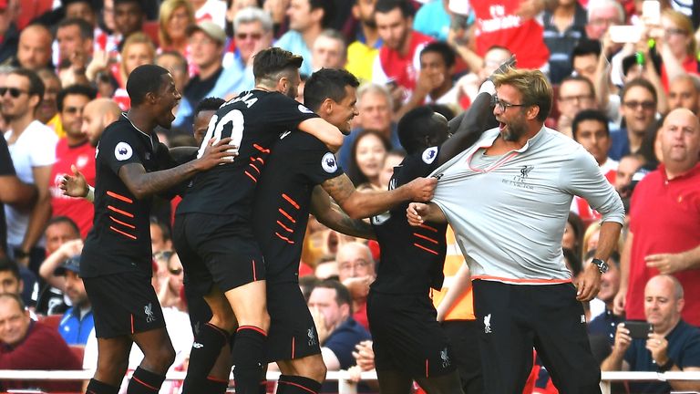 Liverpool players celebrates Sadio Mane's goal with manager Jurgen Klopp