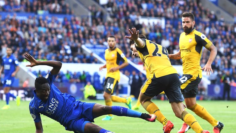 Ahmed Musa goes to ground under pressure from Hector Bellerin