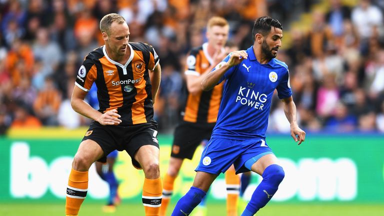 Riyad Mahrez of Leicester City takes the ball away from David Meyler of Hull City during the Premier League match