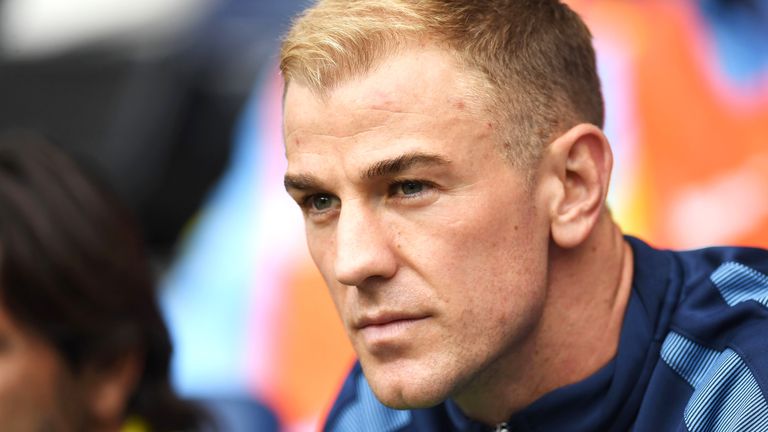 Joe Hart sits on the substitutes bench at the Etihad Stadium