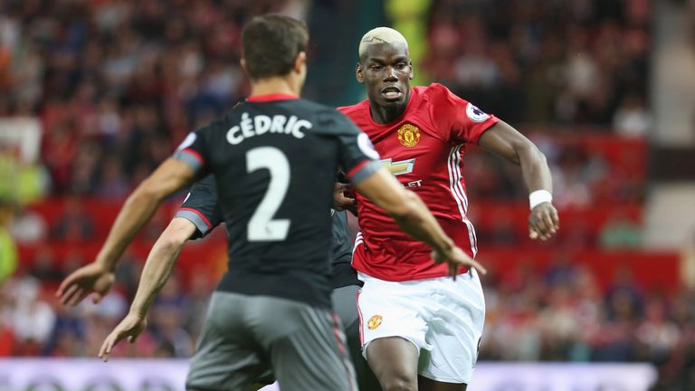 Paul Pogba takes on Cedric at Old Trafford