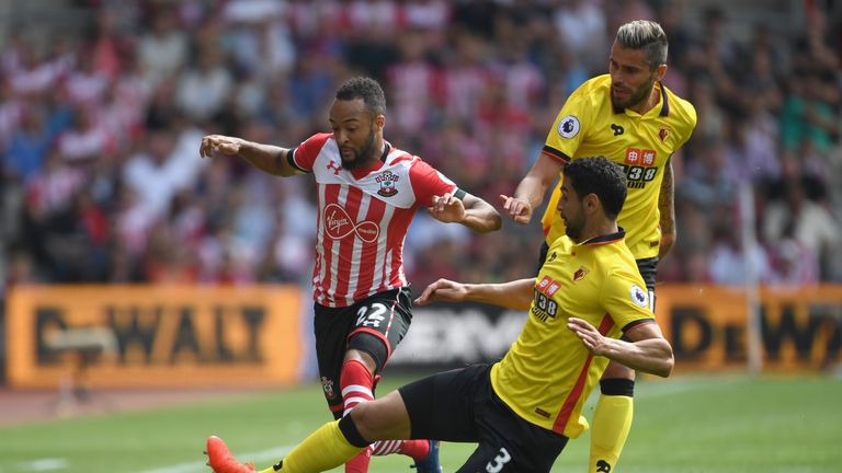 Nathan Redmond of Southampton is tackled by Miguel Britos of Watford during the Premier League match between Southampton 