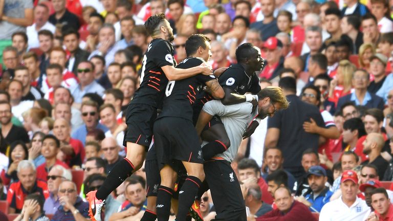 Liverpool players celebrate with manager Jurgen Klopp