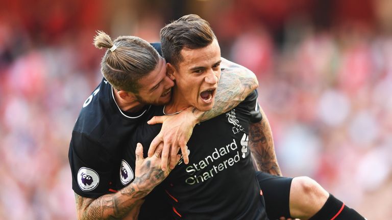 Philippe Coutinho (R) with Alberto Moreno