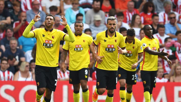 Etienne Capoue of Watford celebrates scoring his sides first goal with his team mates during the Premier League match bet