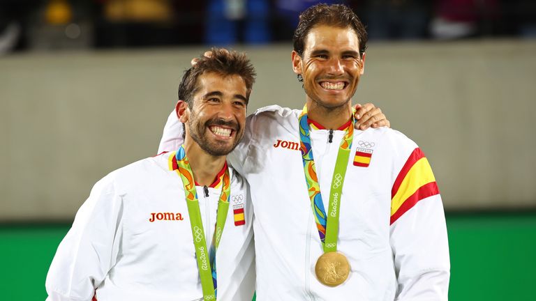 Gold medalists Marc Lopez and Rafael Nadal of Spain stand on the podium after the men's doubles final at the Olympics in Rio