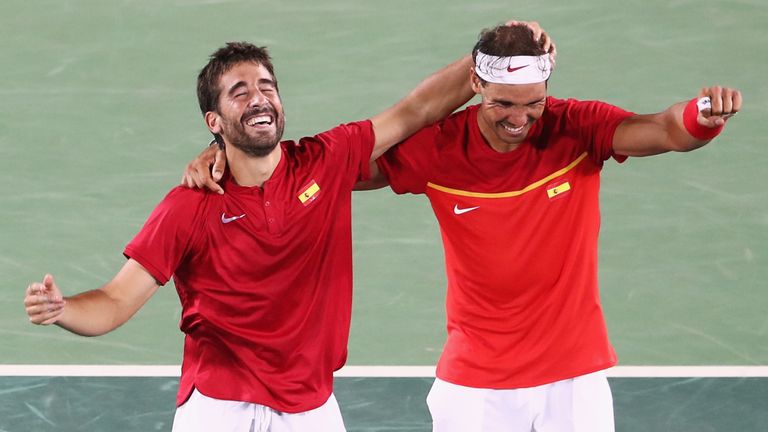 RIO DE JANEIRO, BRAZIL - AUGUST 12:  Marc Lopez and Rafael Nadal of Spain celebrate match point during the Men's Doubles Gold medal match against Horia Tec