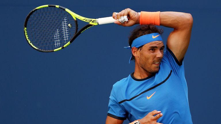 NEW YORK, NY - AUGUST 29:  Rafael Nadal of Spain returns a shot to Denis Istomin of Uzbekistan during his first round Men's Singles match on Day One of the