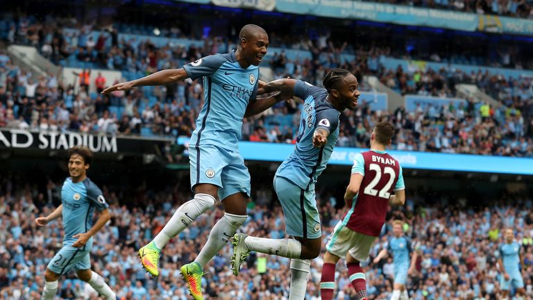 Manchester City's Raheem Sterling celebrates with team-mate Fernandinho 